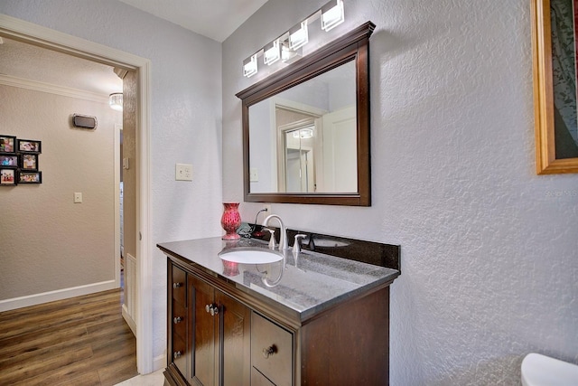 bathroom with hardwood / wood-style flooring and vanity