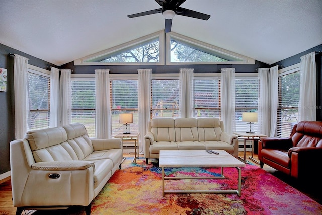 sunroom / solarium with ceiling fan and lofted ceiling