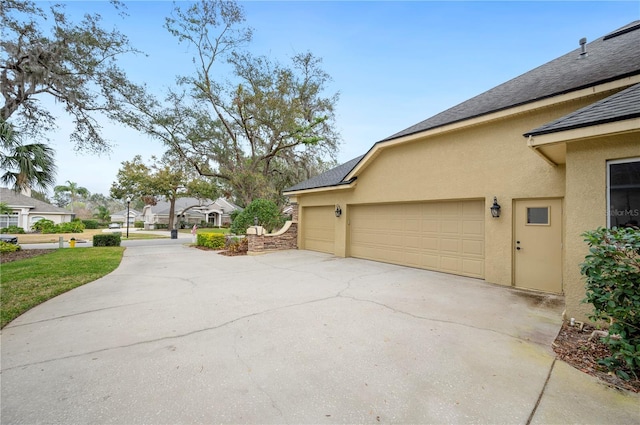 view of side of home with a garage