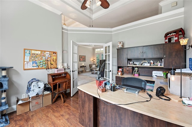 home office featuring crown molding, ceiling fan, dark hardwood / wood-style floors, french doors, and a raised ceiling