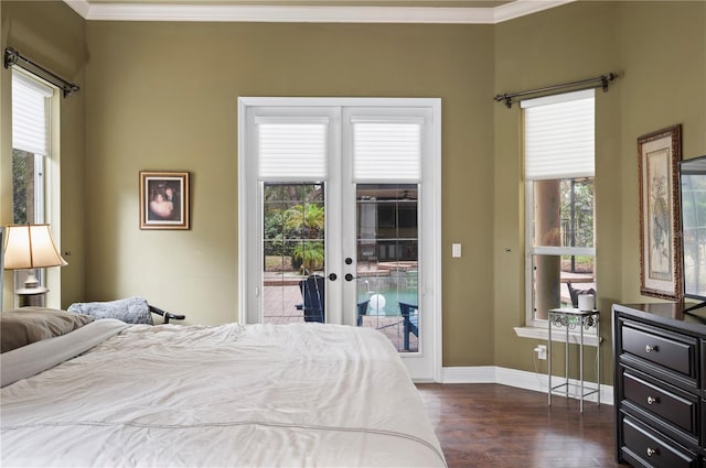 bedroom featuring dark hardwood / wood-style flooring, access to exterior, crown molding, and french doors