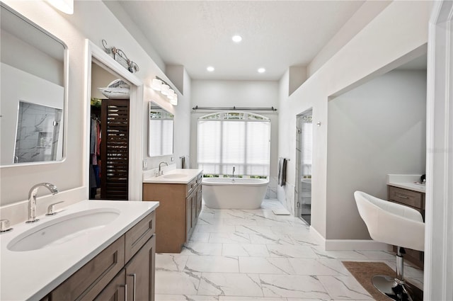 bathroom featuring vanity and shower with separate bathtub