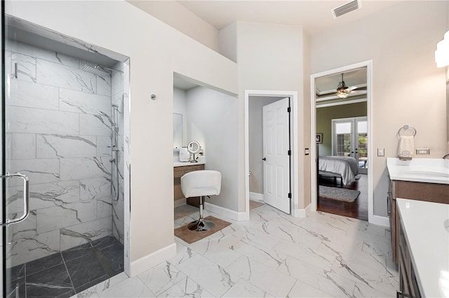 bathroom with french doors, ceiling fan, vanity, and an enclosed shower