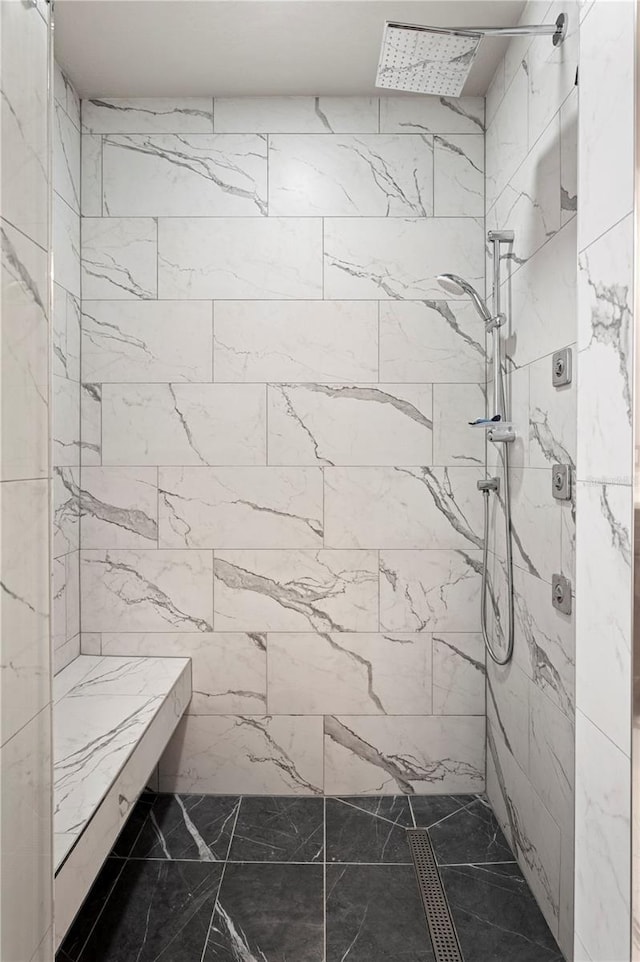 bathroom with tiled shower