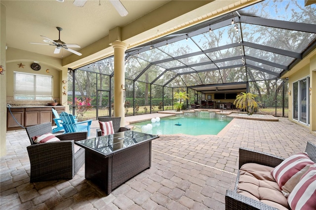 view of pool featuring a lanai, outdoor lounge area, and a patio area