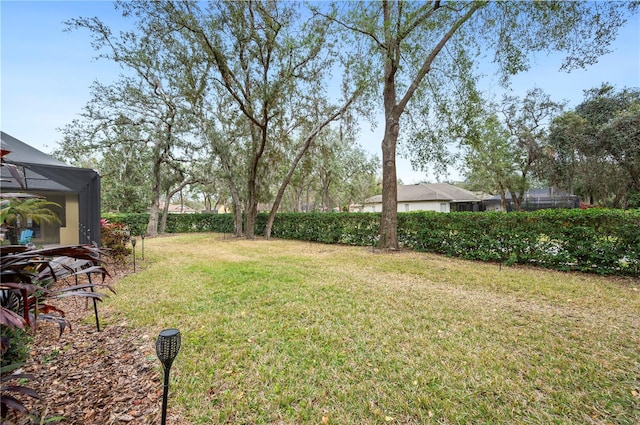 view of yard featuring a lanai