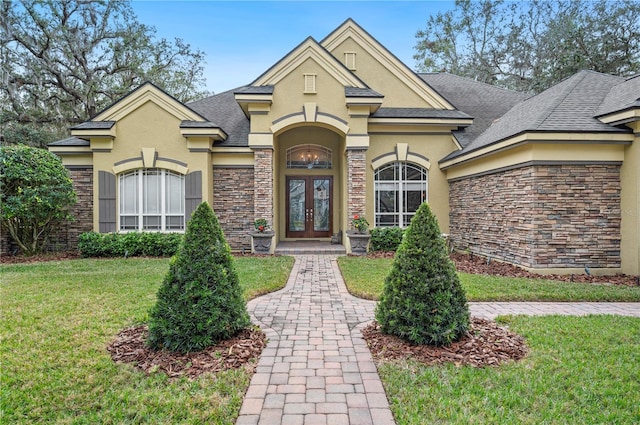 view of front of home featuring a front yard and french doors