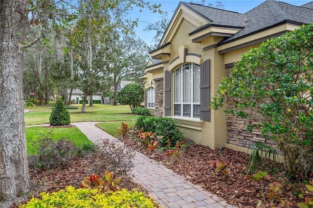 view of home's exterior featuring a yard