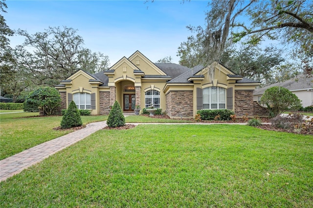 view of front of house with a front lawn and french doors