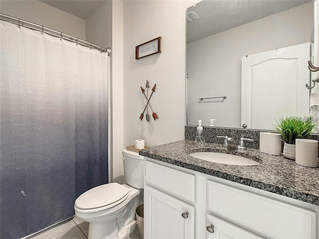 full bath with tile patterned floors, toilet, and vanity