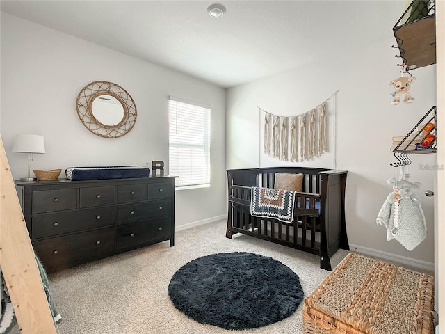 bedroom with baseboards and carpet flooring