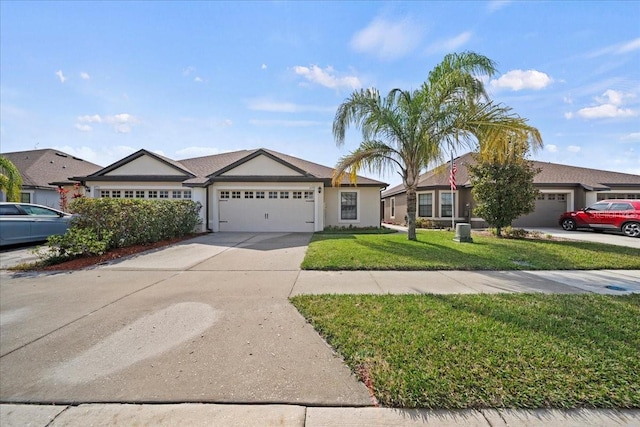 ranch-style home featuring a garage and a front yard