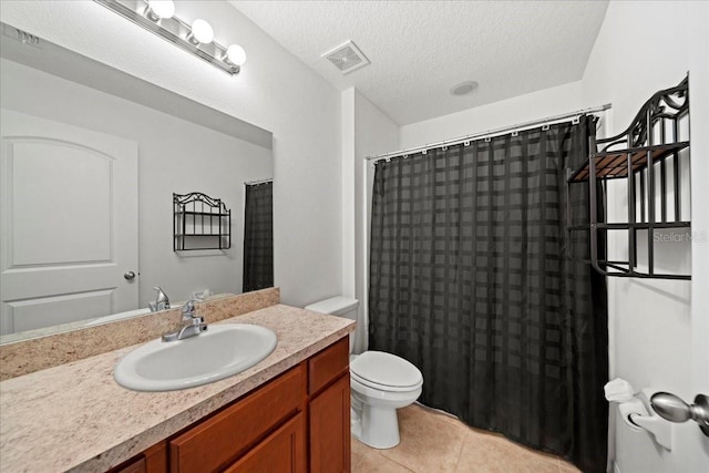 bathroom with a shower with shower curtain, vanity, a textured ceiling, tile patterned floors, and toilet