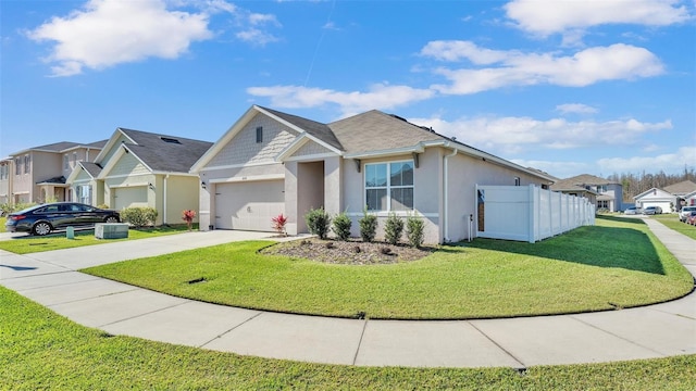 view of front of house featuring a front yard, driveway, a residential view, and stucco siding