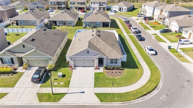 birds eye view of property with a residential view