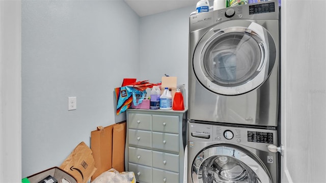 laundry room with laundry area and stacked washing maching and dryer