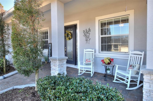 property entrance with covered porch