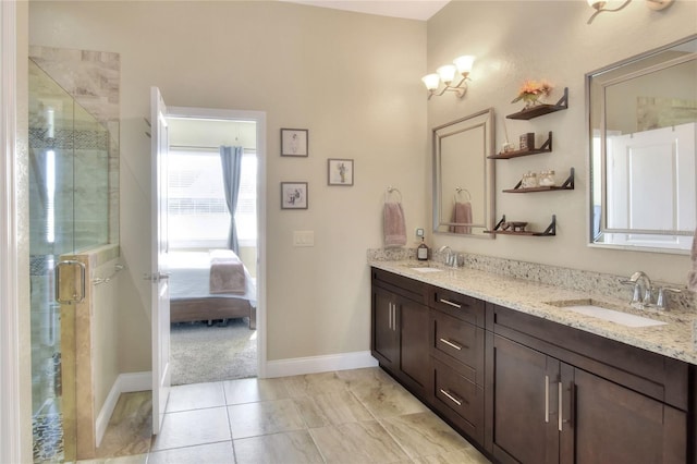 bathroom featuring vanity and an enclosed shower