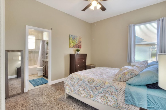 bedroom featuring ceiling fan, connected bathroom, and carpet floors