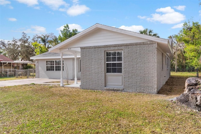 view of front of property with a patio and a front lawn