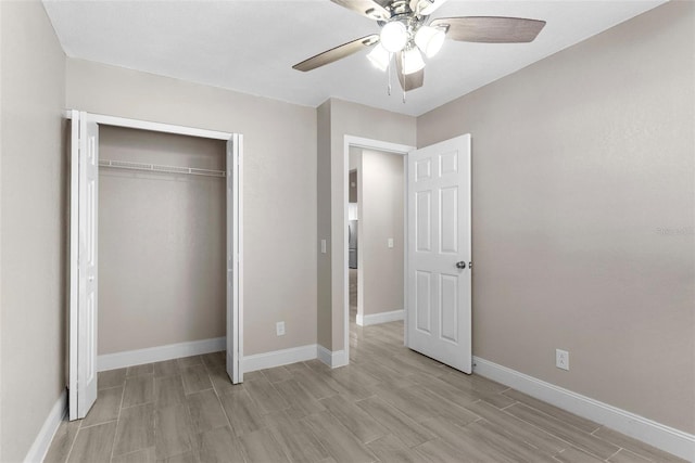 unfurnished bedroom with ceiling fan, light hardwood / wood-style floors, and a closet