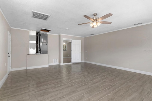 unfurnished living room featuring ornamental molding, hardwood / wood-style floors, a textured ceiling, and ceiling fan