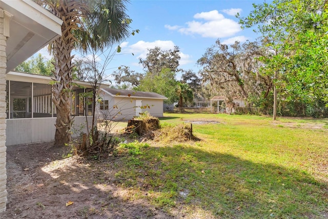 view of yard with a sunroom