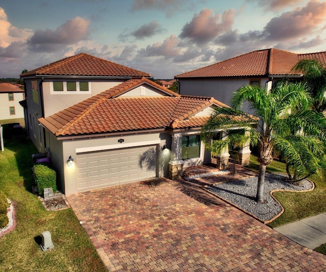 mediterranean / spanish-style home featuring a garage