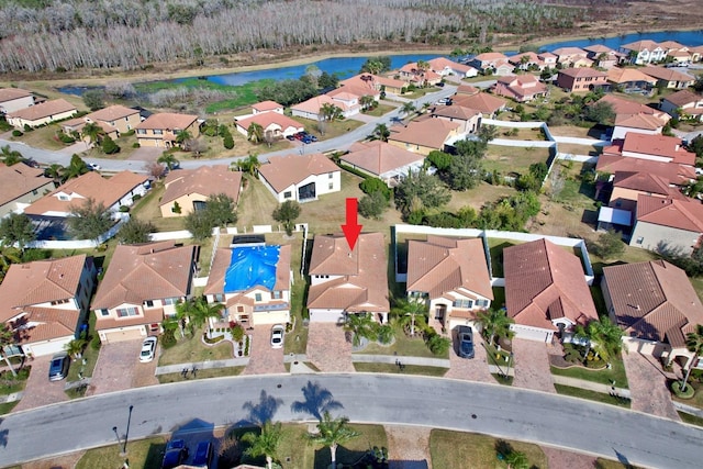 bird's eye view with a water view