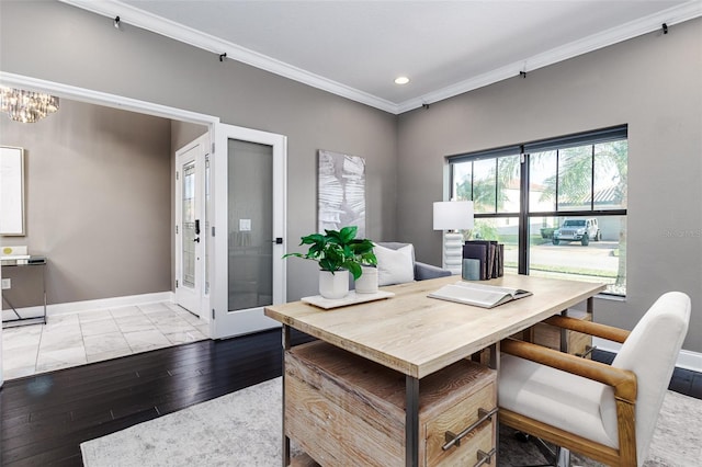 office space with ornamental molding, a chandelier, and light wood-type flooring