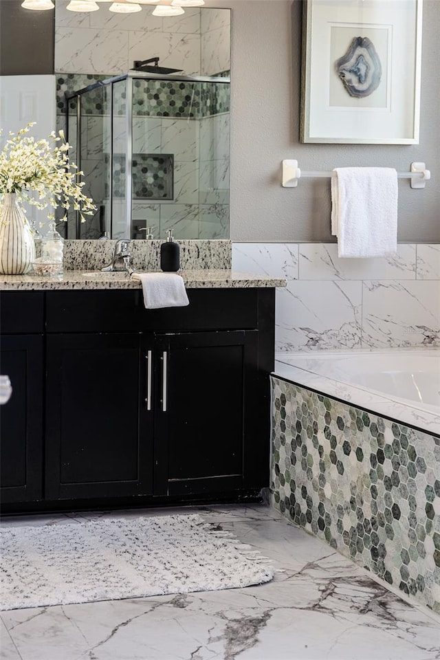 bathroom with vanity and a shower with shower door