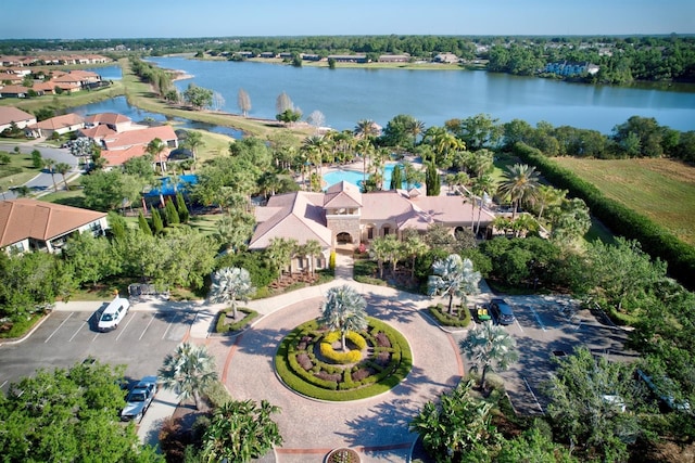 birds eye view of property with a water view