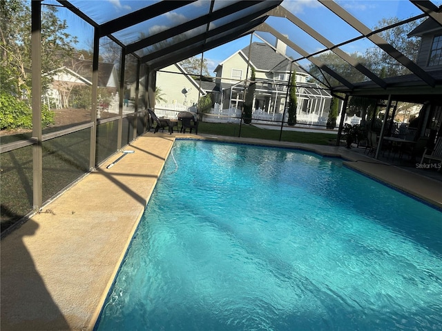 view of pool with a lanai