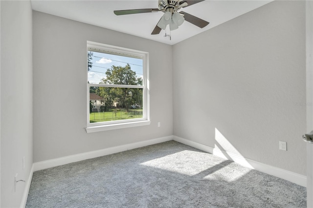 spare room with ceiling fan and carpet floors