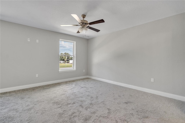 empty room featuring carpet flooring, a textured ceiling, and ceiling fan