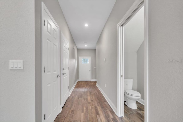 hall with dark hardwood / wood-style floors