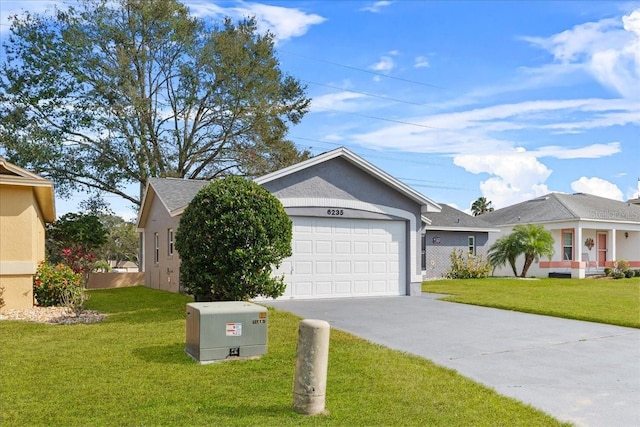 ranch-style home featuring a garage and a front lawn