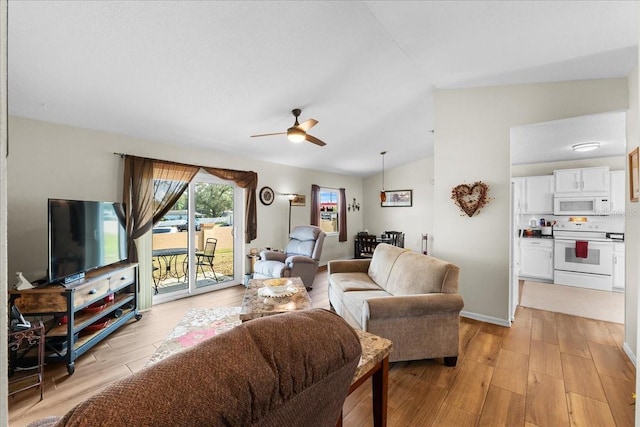 living room with lofted ceiling, light hardwood / wood-style floors, and ceiling fan