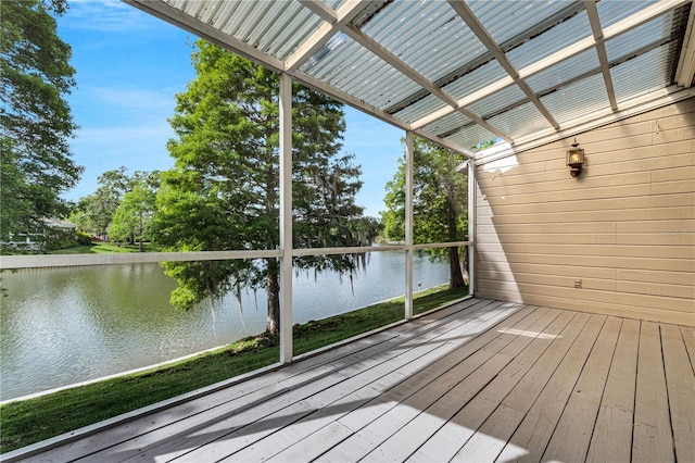 wooden terrace featuring a water view