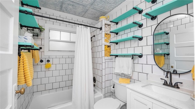 full bathroom with toilet, tasteful backsplash, tile walls, vanity, and shower / bath combo