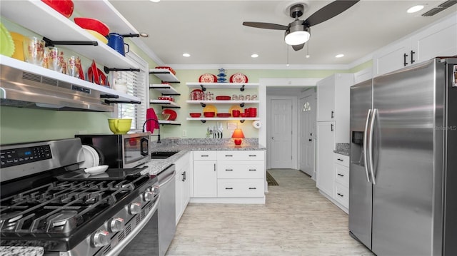 kitchen featuring stainless steel appliances, ornamental molding, white cabinets, and light stone counters