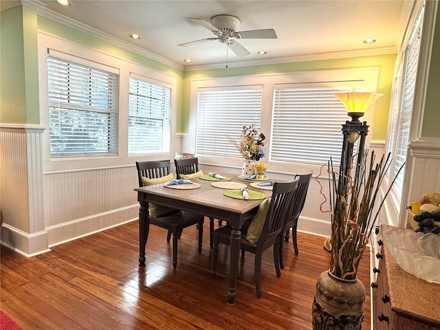 dining area featuring hardwood / wood-style floors, crown molding, and ceiling fan