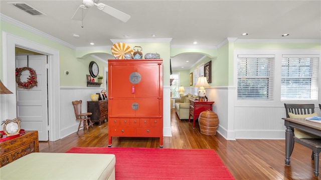 interior space with hardwood / wood-style flooring and ornamental molding