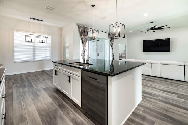 kitchen with white cabinets, decorative light fixtures, sink, and dishwasher