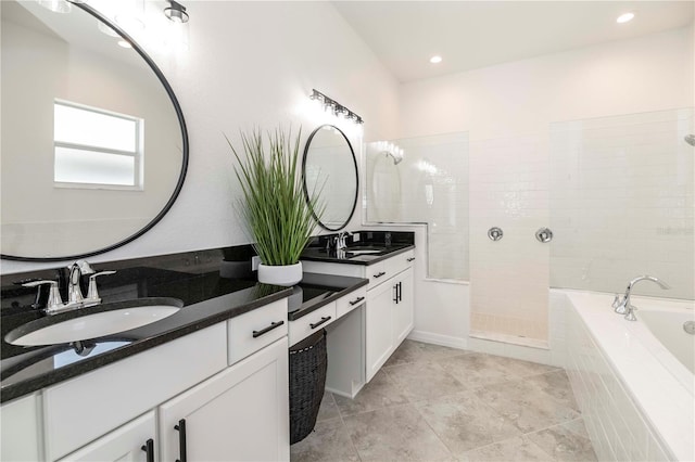 bathroom with vanity and plus walk in shower