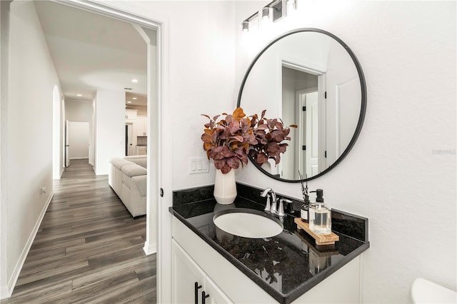 bathroom featuring vanity and wood-type flooring