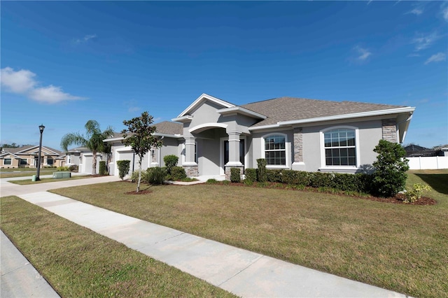 view of front facade with a garage and a front yard