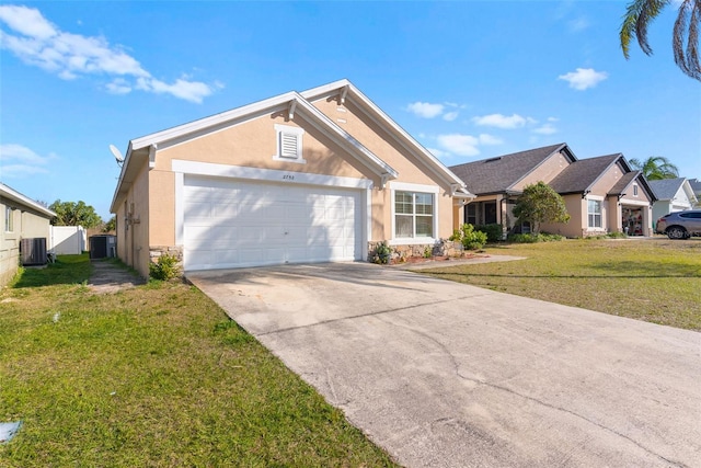 view of front of property featuring a garage, a front yard, and central air condition unit