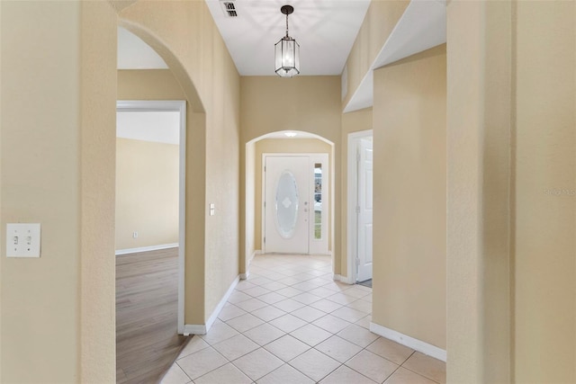 entryway featuring light tile patterned flooring