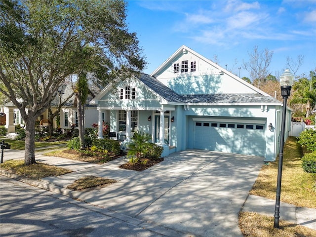 view of front facade featuring a garage and covered porch